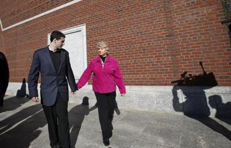 Patricia Donahue, wife of victim Michael Donahue, held hands with her grandson, Shawn.
